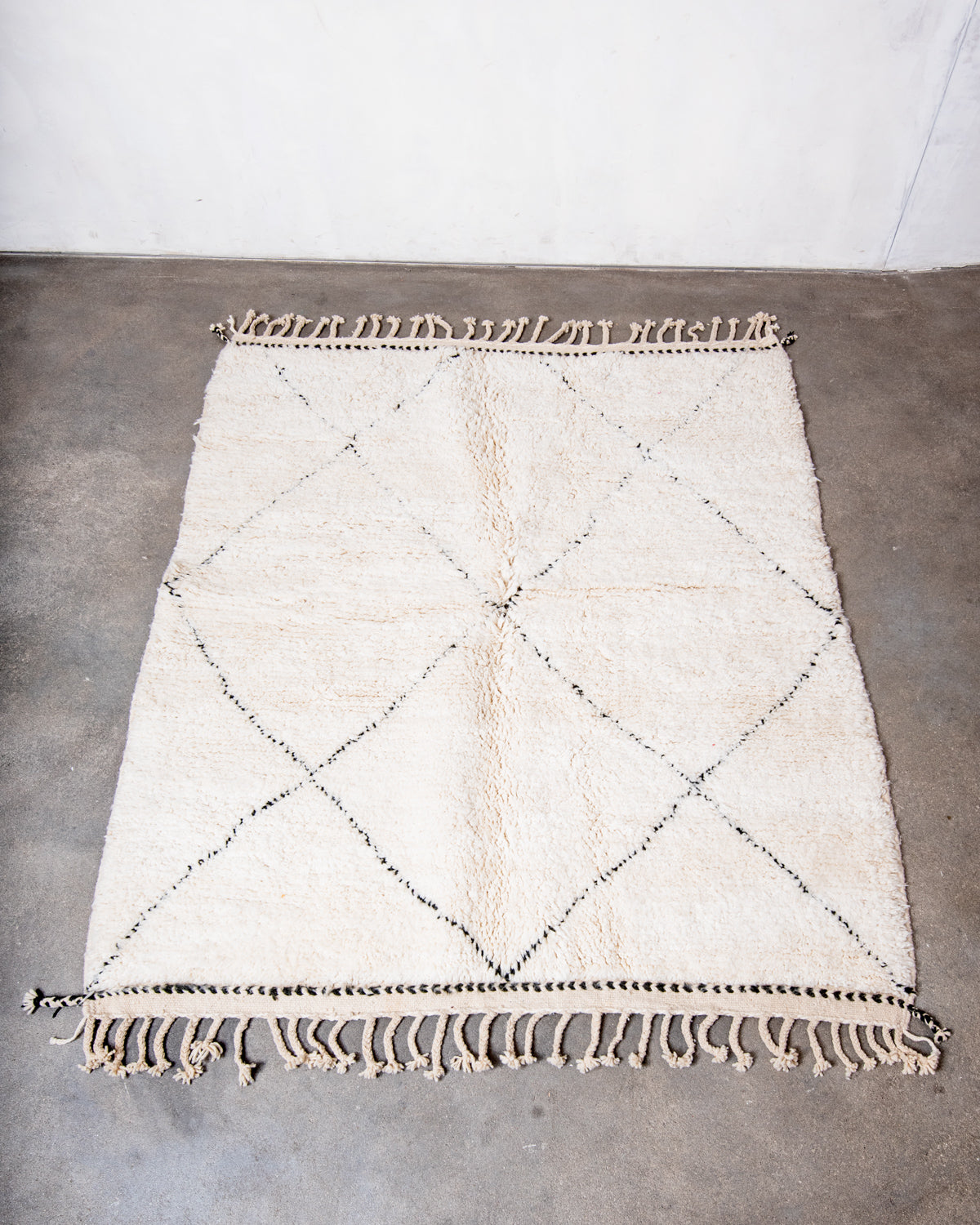 Modern, designer, handcrafted Berber rug from Morocco. Beniourain carpet with minimalist design, natural wool pile and a fluffy texture.